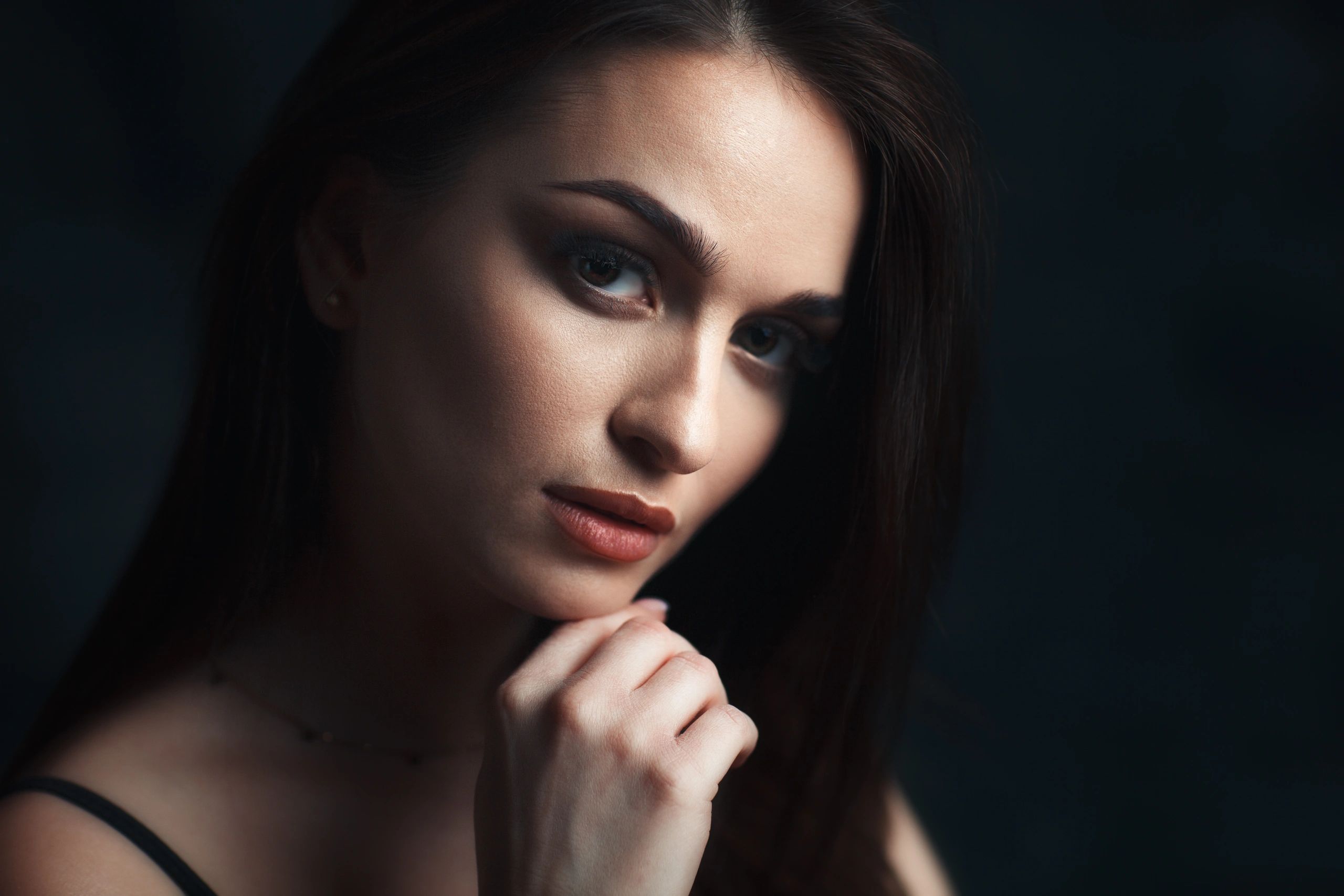 Elegant portrait of a woman in soft studio light