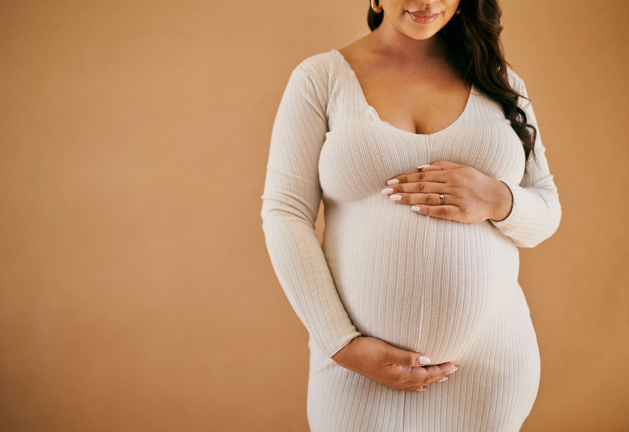 Elegant maternity portrait in neutral tones